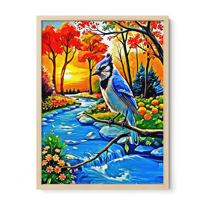 Framed painting of a blue jay on a branch by a vibrant autumn landscape with a river and sunset.