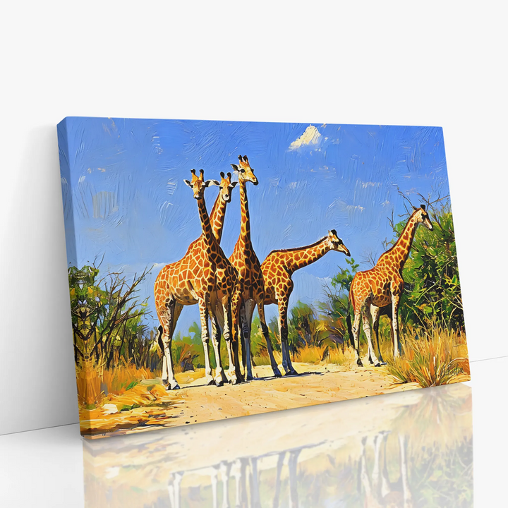 Canvas print featuring a group of giraffes standing on a dirt path in a savanna landscape.