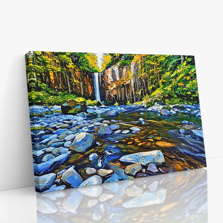 Canvas painting of a vibrant forest scene with a waterfall and rocky stream.