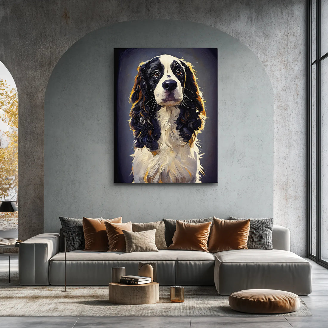 A modern living room with a large, realistic painting of a black and white dog above a gray sectional sofa adorned with assorted cushions.